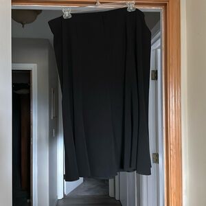 Woman’s black skirt with kick at the bottom